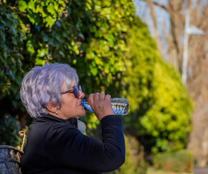 Woman drinking bottled water